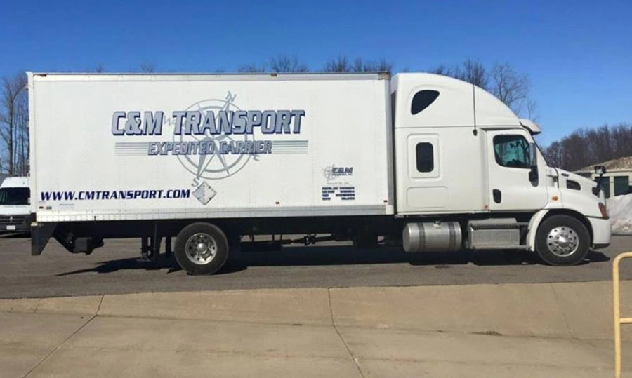 Truck with C&M Transport Expedited Carrier logo