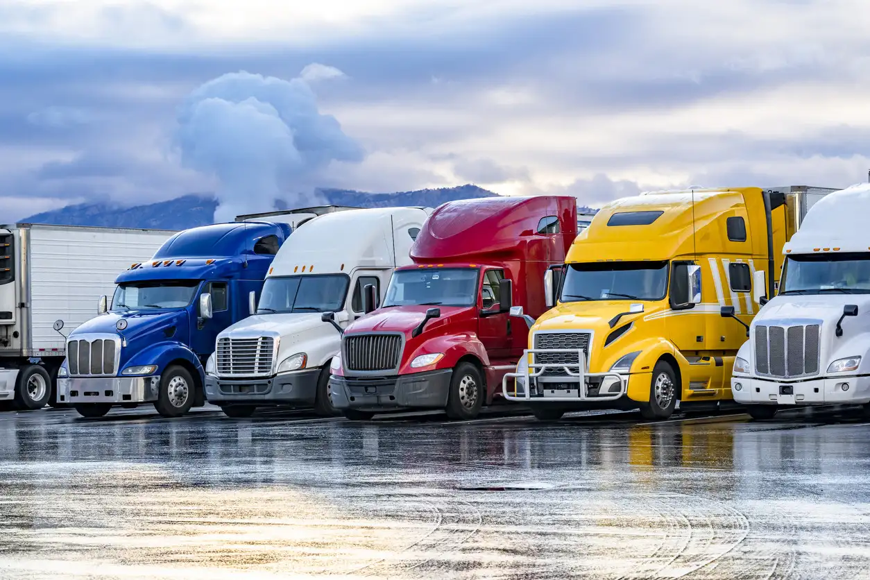 Colorful fleet of big rig tractor trailers